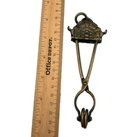 Victorian Brass Skirt Lifter with Geometric Design 6 1/4