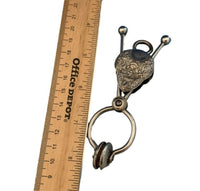 Silverplated Floral Skirt Lifter with Flowers Marked Fyfe's Patent (#J1344)